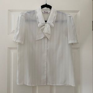 Vintage pin-striped bow blouse in cream.